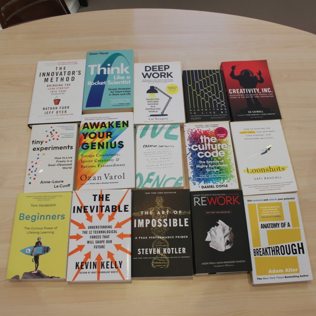 A selection of creativity, technology and innovation books from HyperWeb's working bookshelf in Newcastle.